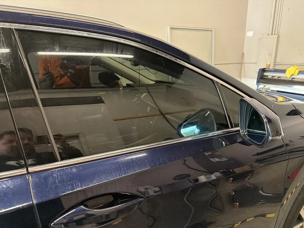 Close view of tinted side glass on a blue vehicle, photographed by Google reviewer alexandru budeanu